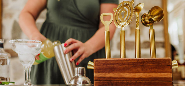 woman making a margarita using a tabletop bar set