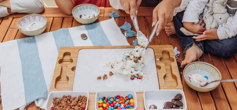 ice cream mixing station with kids and mom creating their own ice cream